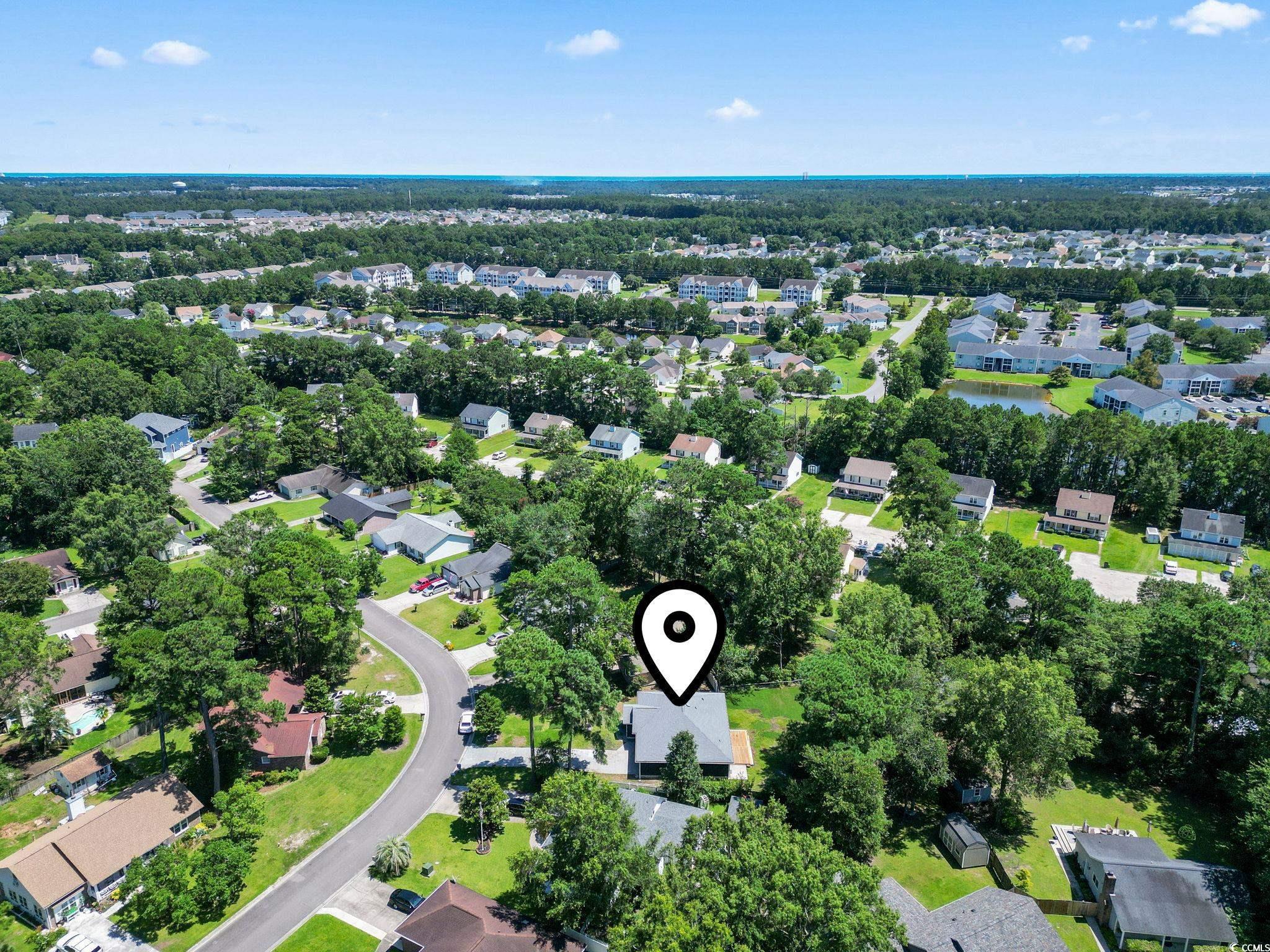 220 Rice Mill Drive Myrtle Beach, SC 29588 - Photo 29 of 31 Aerial view of property's location with nearby suburban area and a tree filled landscape