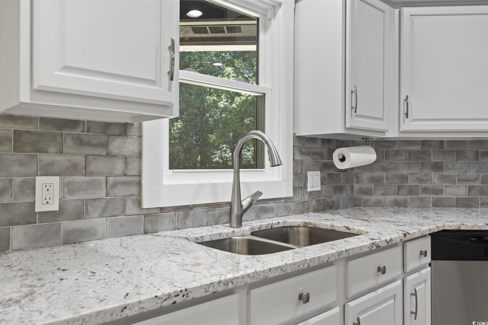 220 Rice Mill Drive Myrtle Beach, SC 29588 - Photo 8 of 31 Kitchen featuring white cabinets, decorative backsplash, dishwasher, and light stone counters