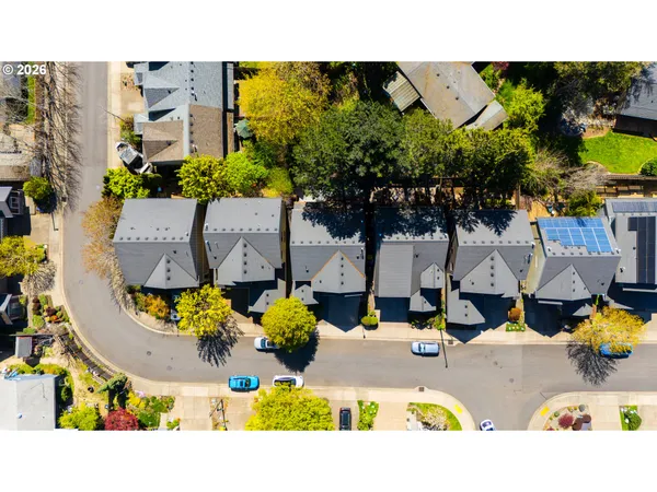 an aerial view of a house with a swimming pool