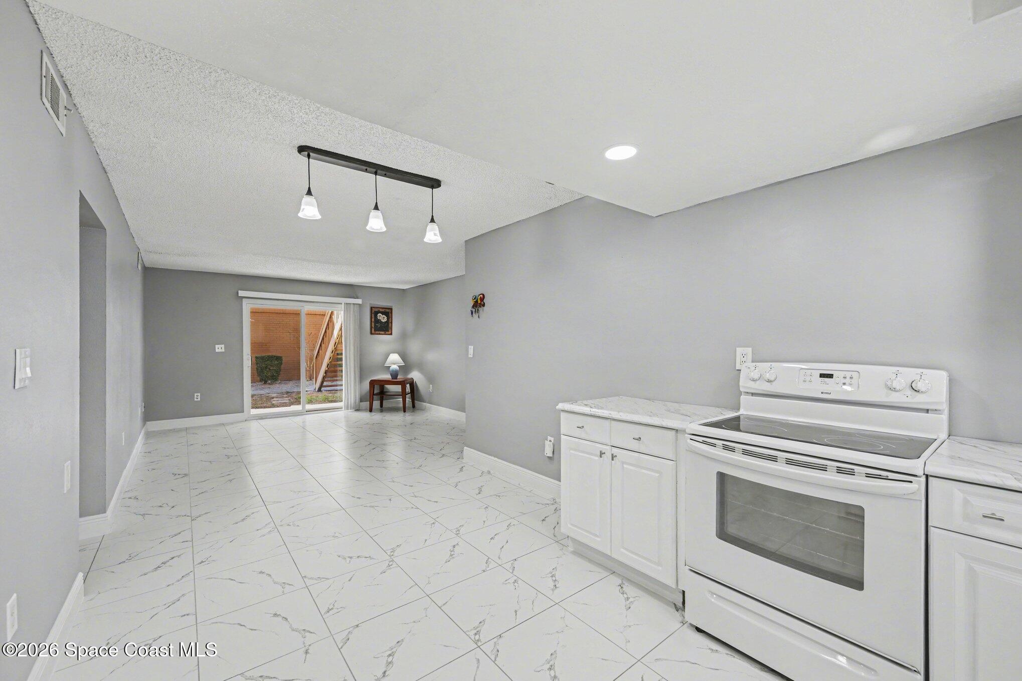 101 Bristol Lane, Unit 101 Melbourne, FL 32935 - Photo 6 of 16 a view of a livingroom with washer and dryer