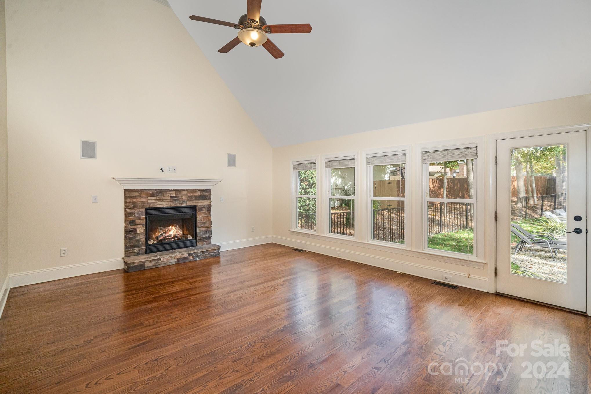 4125 Lake Shore Road South Denver, NC 28037 - Photo 6 of 38 wooden floor fireplace and natural light in room