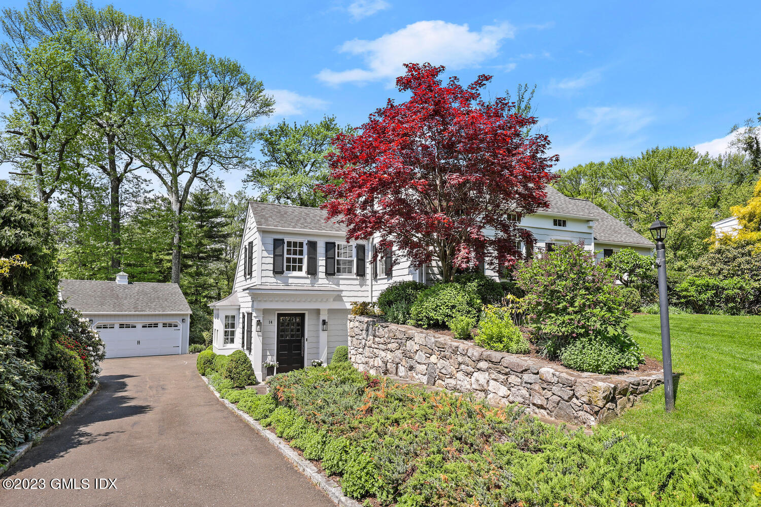 14 Crescent Road Riverside, CT 06878 - Photo 2 of 28 a front view of a house with a garden