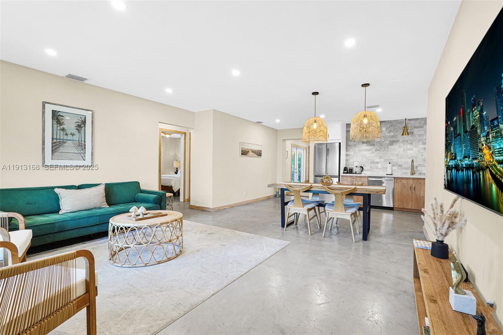 1012 Northeast 2nd Street Hallandale Beach, FL 33009 - Photo 14 of 65 a living room with furniture and a large window