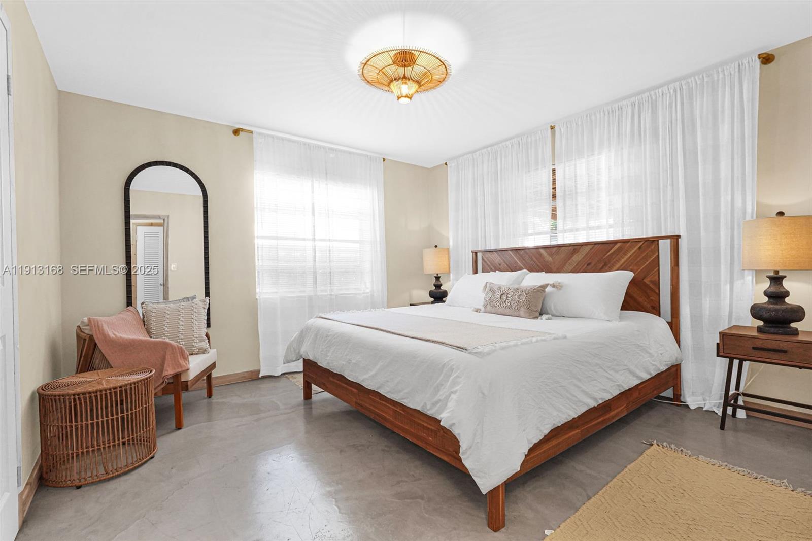 1012 Northeast 2nd Street Hallandale Beach, FL 33009 - Photo 26 of 65 a bedroom with a bed and a couch