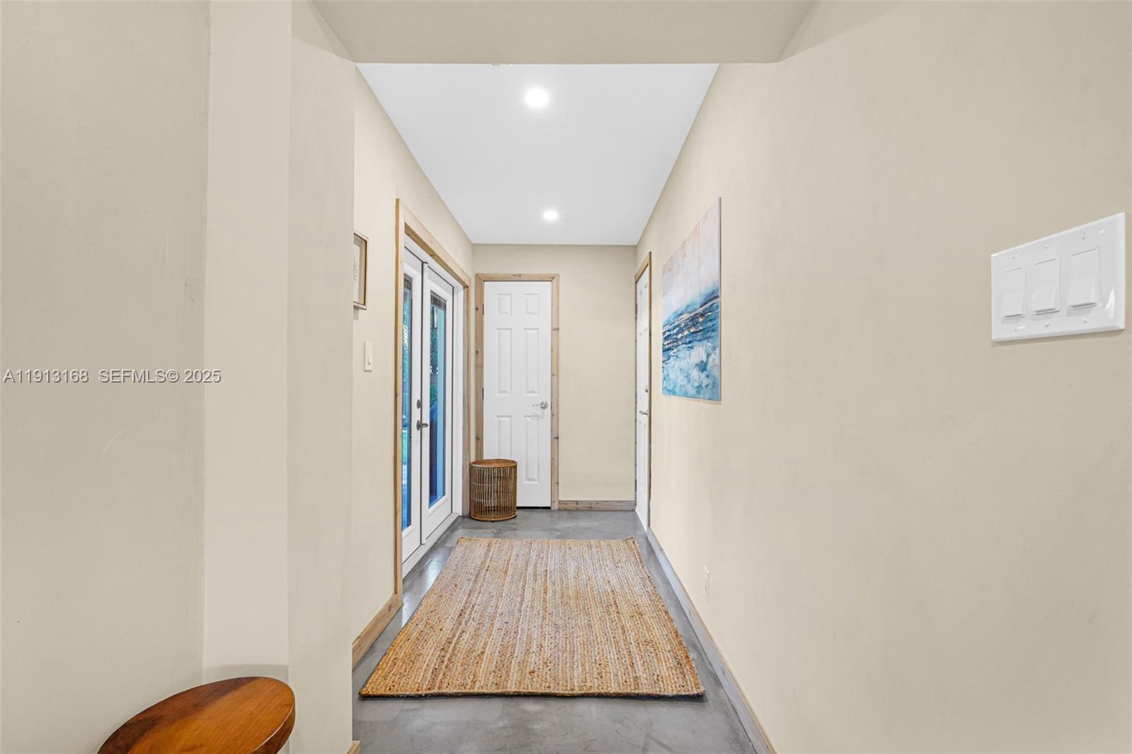 1012 Northeast 2nd Street Hallandale Beach, FL 33009 - Photo 32 of 65 a view of a hallway with wooden floor and closet