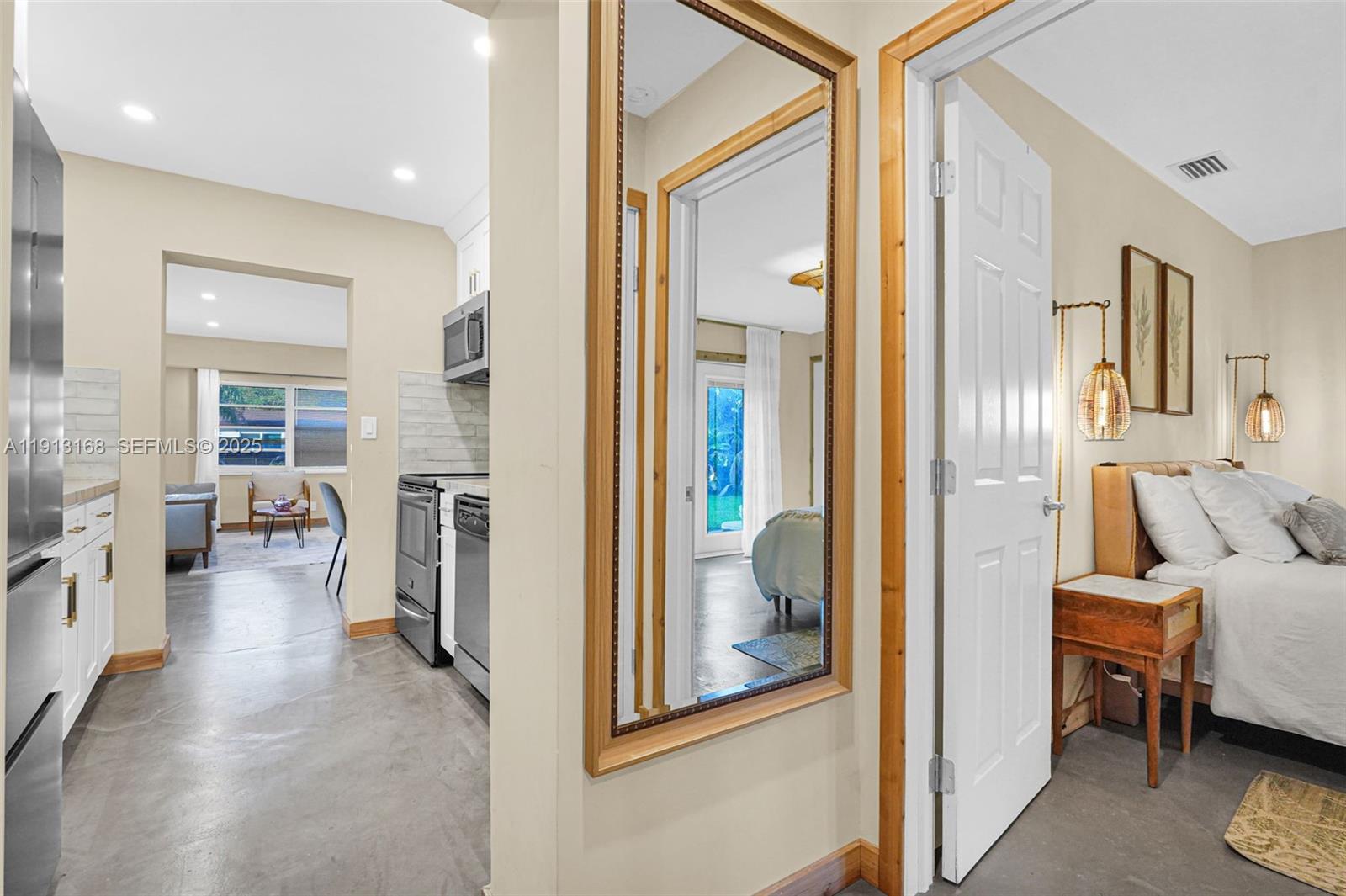 1012 Northeast 2nd Street Hallandale Beach, FL 33009 - Photo 45 of 65 a view of a livingroom with furniture and windows