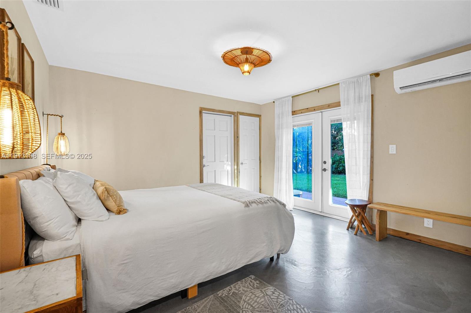 1012 Northeast 2nd Street Hallandale Beach, FL 33009 - Photo 46 of 65 a bedroom with a bed and a large window