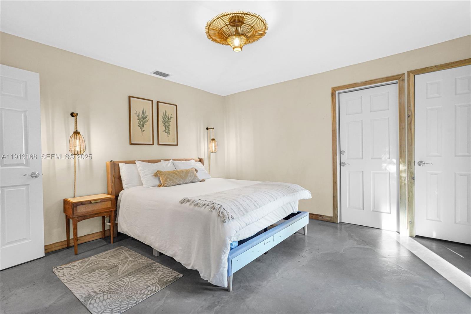 1012 Northeast 2nd Street Hallandale Beach, FL 33009 - Photo 47 of 65 a bedroom with a bed and painting on the wall