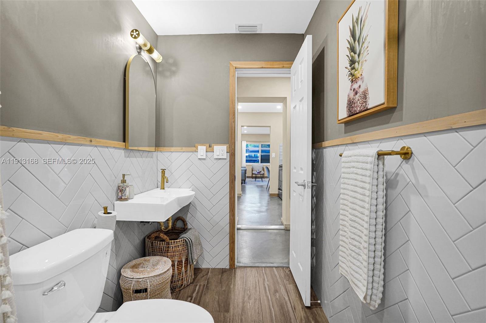 1012 Northeast 2nd Street Hallandale Beach, FL 33009 - Photo 51 of 65 a bathroom with a sink a toilet and shower