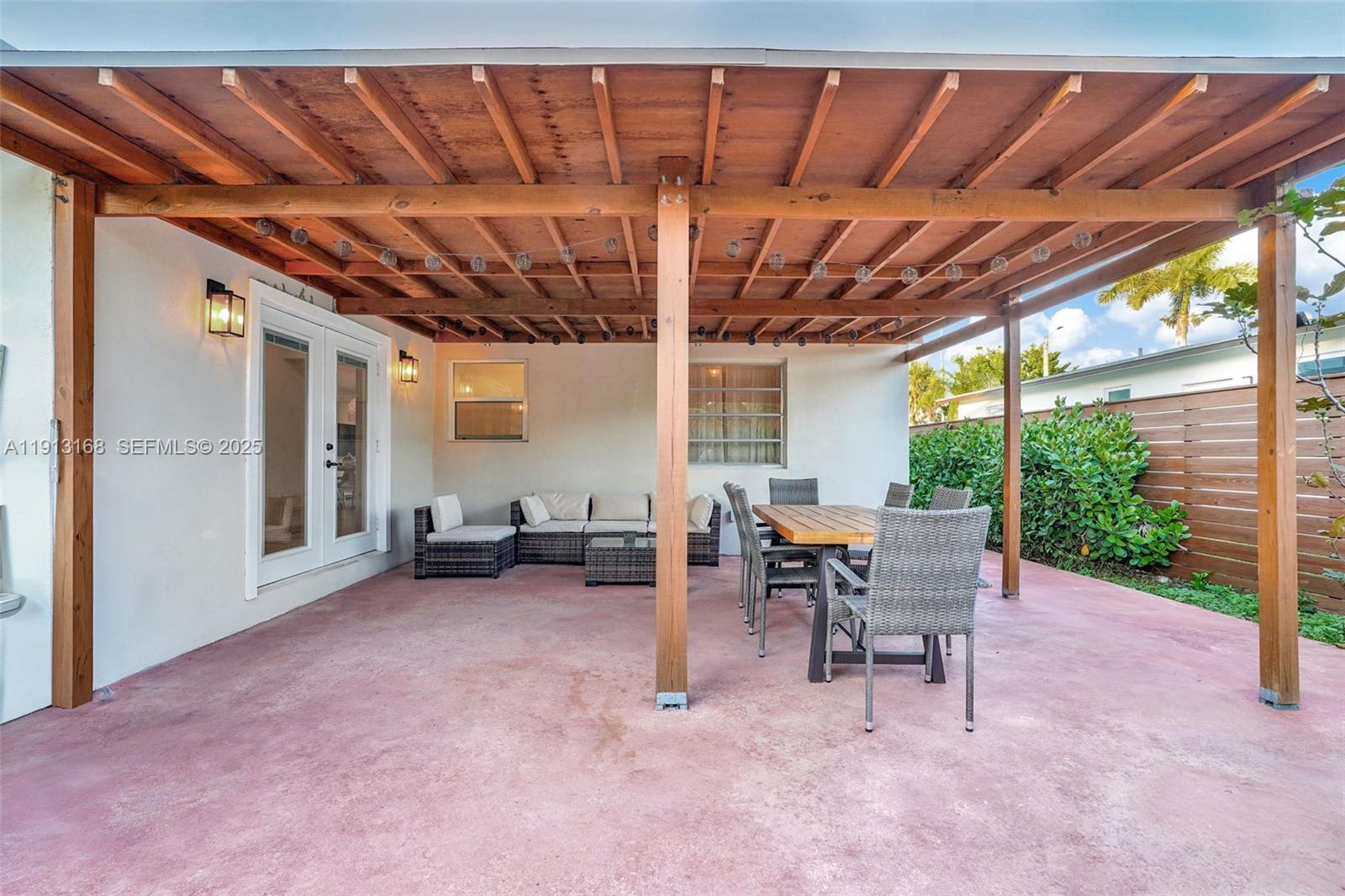 1012 Northeast 2nd Street Hallandale Beach, FL 33009 - Photo 57 of 65 a view of a big room with a table and chairs