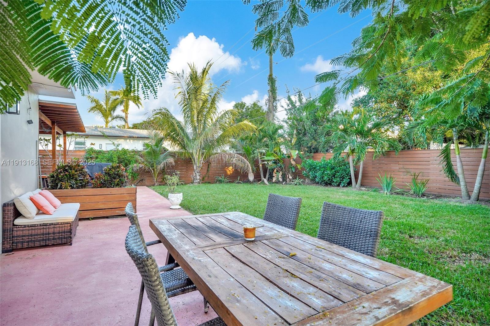 1012 Northeast 2nd Street Hallandale Beach, FL 33009 - Photo 62 of 65 a view of a patio with swimming pool