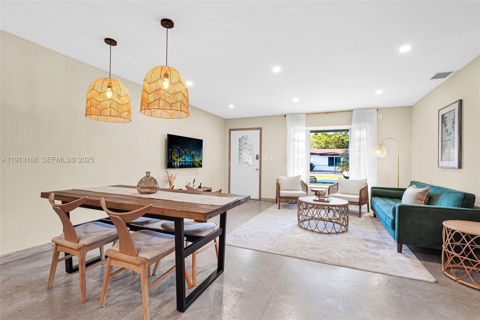 1012 Northeast 2nd Street Hallandale Beach, FL 33009 - Photo 10 of 65 a view of a dining room with furniture window and outside view