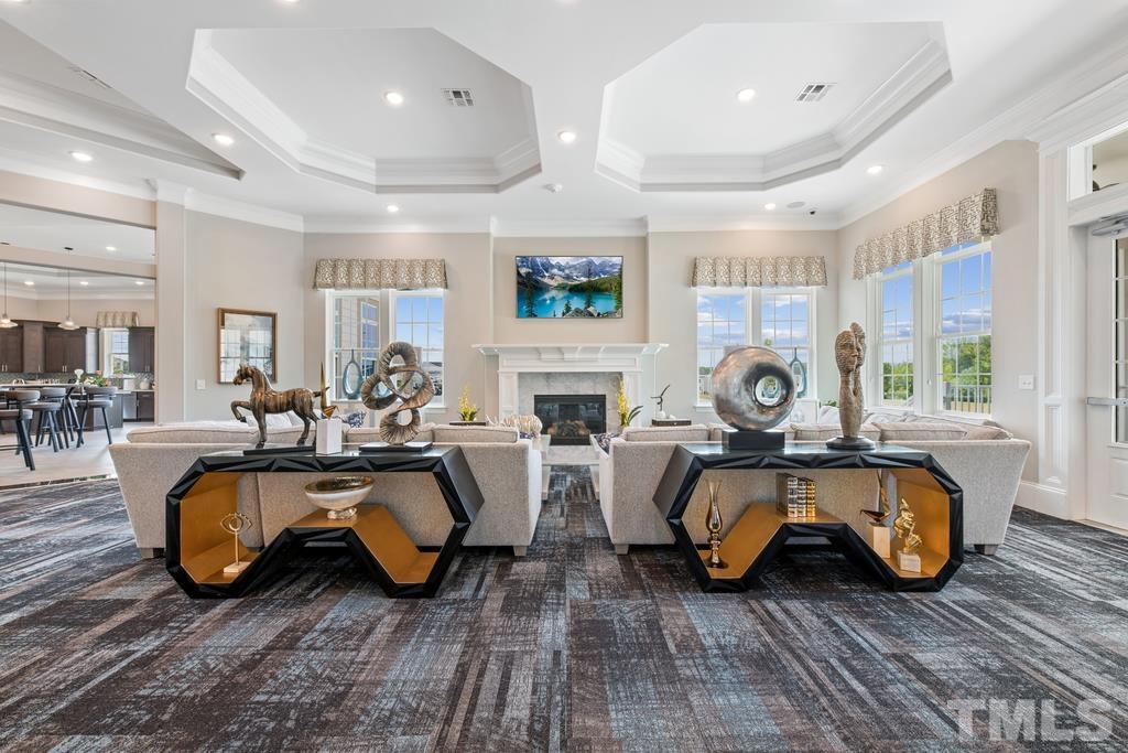 2009 Abbeyhill Drive Raleigh, NC 27610 - Photo 5 of 12 a living room with furniture a fireplace and a large window