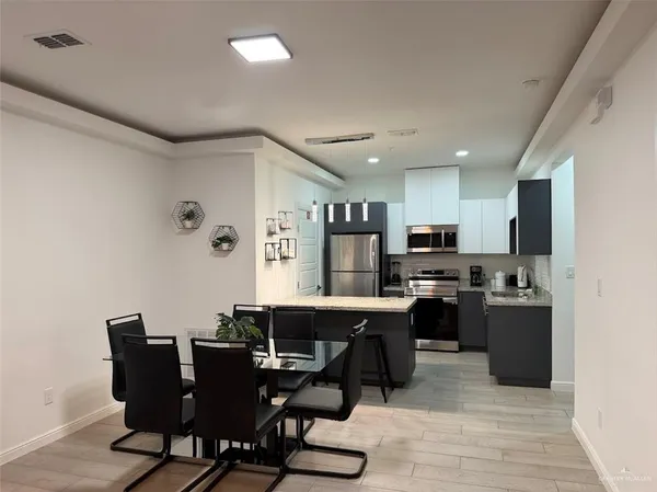 a view of a dining room with furniture