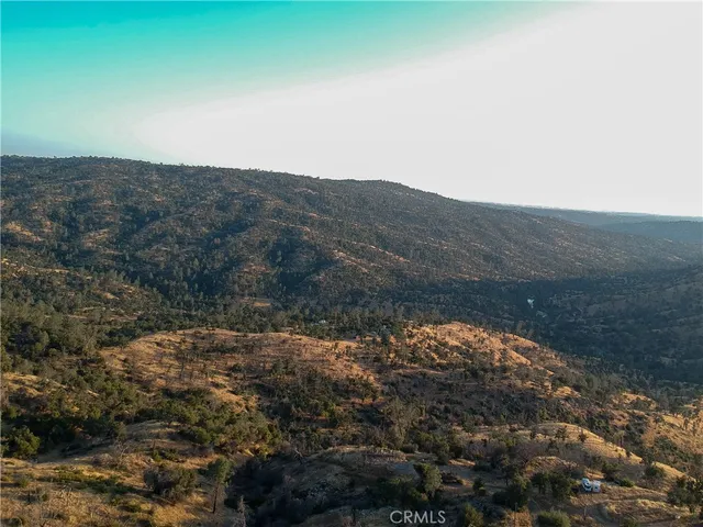 a view of mountain with sunset