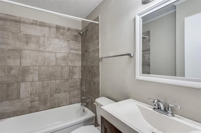 a bathroom with a sink and a bathtub