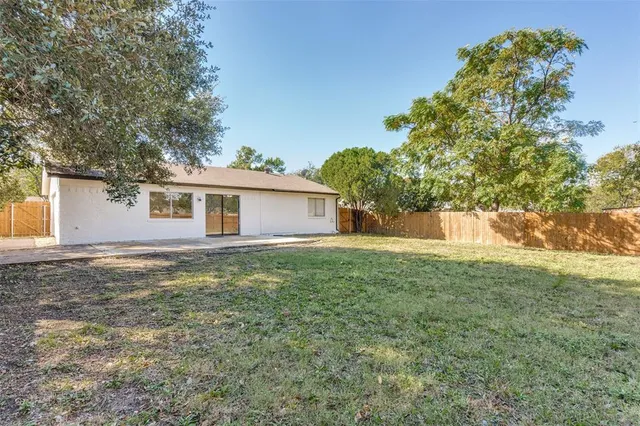 a backyard of a house with lots of green space