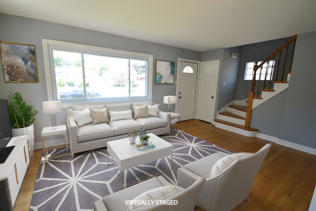 1517 Morris Avenue Berkeley, IL 60163 - Photo 2 of 35 a living room with furniture and a large window