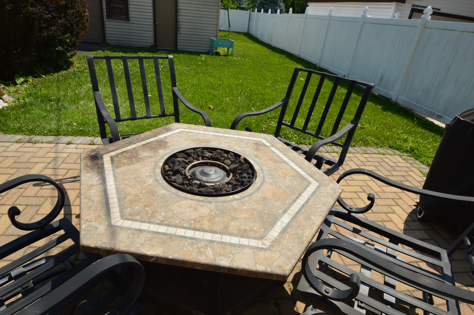 1517 Morris Avenue Berkeley, IL 60163 - Photo 34 of 35 a view of a backyard with sitting area and a garden