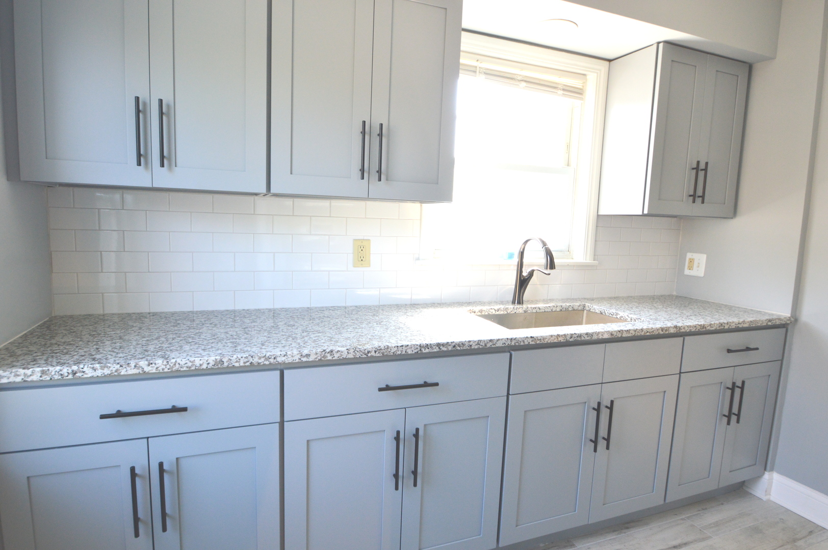 1517 Morris Avenue Berkeley, IL 60163 - Photo 6 of 35 a kitchen with white cabinets
