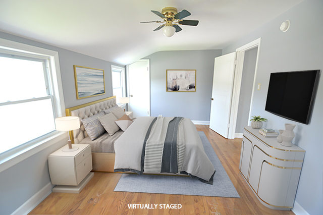 1517 Morris Avenue Berkeley, IL 60163 - Photo 9 of 35 a bedroom with a bed and a flat screen tv