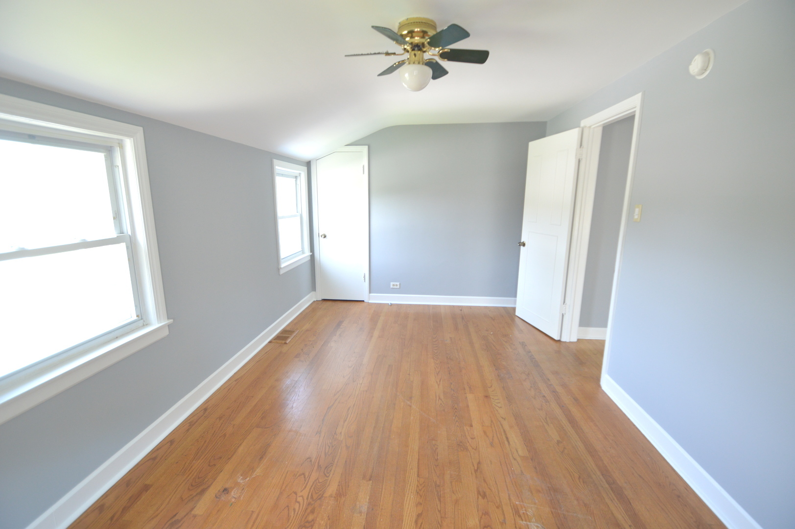 1517 Morris Avenue Berkeley, IL 60163 - Photo 10 of 35 a view of empty room with wooden floor and fan