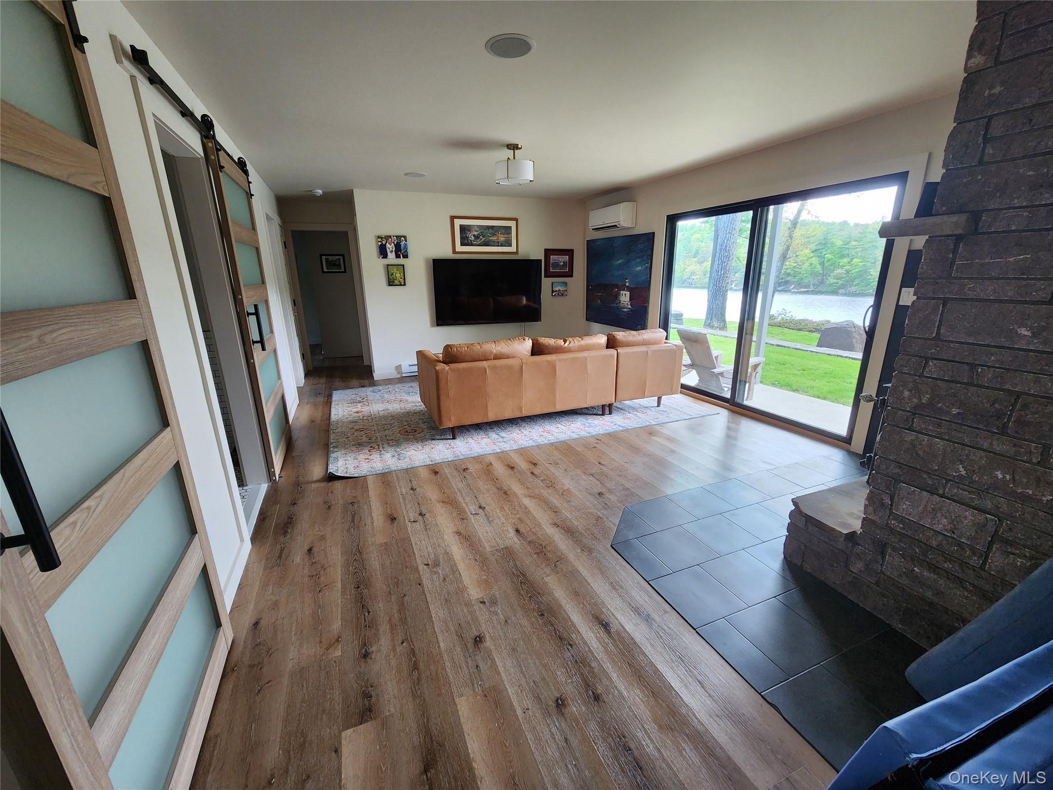 53 Lake Pleasant Road Staatsburg, NY 12580 - Photo 24 of 34 a living room with furniture and a flat screen tv