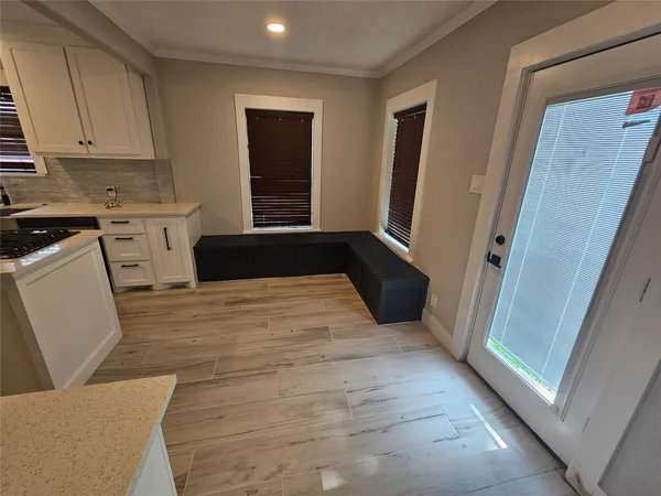 a kitchen with a refrigerator and window