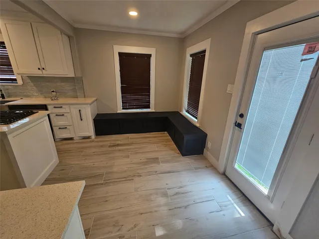 a kitchen with a refrigerator and window