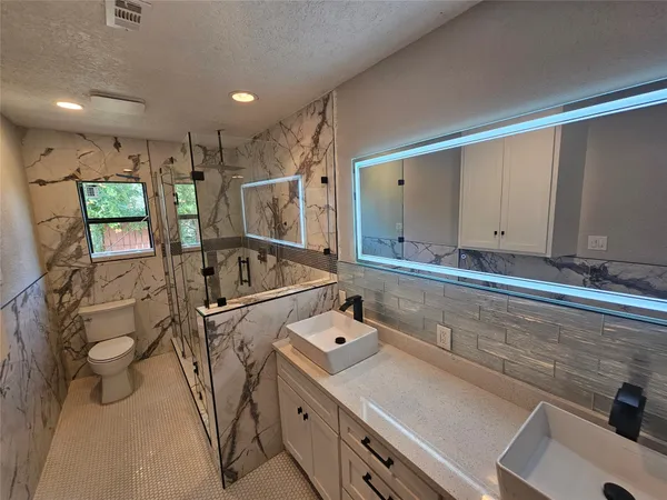 a utility room with cabinets