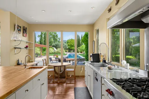 a view of a hallway view with wooden floor and furniture