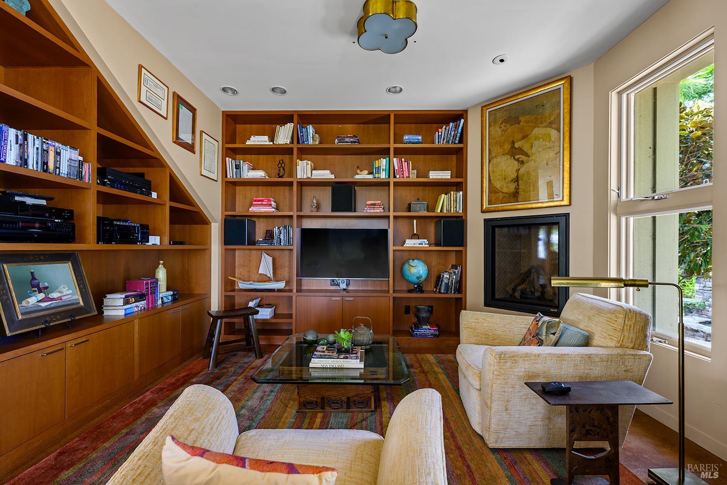 6003-6017 Red Winery Road Geyserville, CA 95441 - Photo 23 of 97 a living room with fireplace furniture and a book shelf