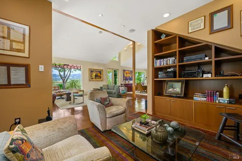 swimming pool view with a seating space and a garden view