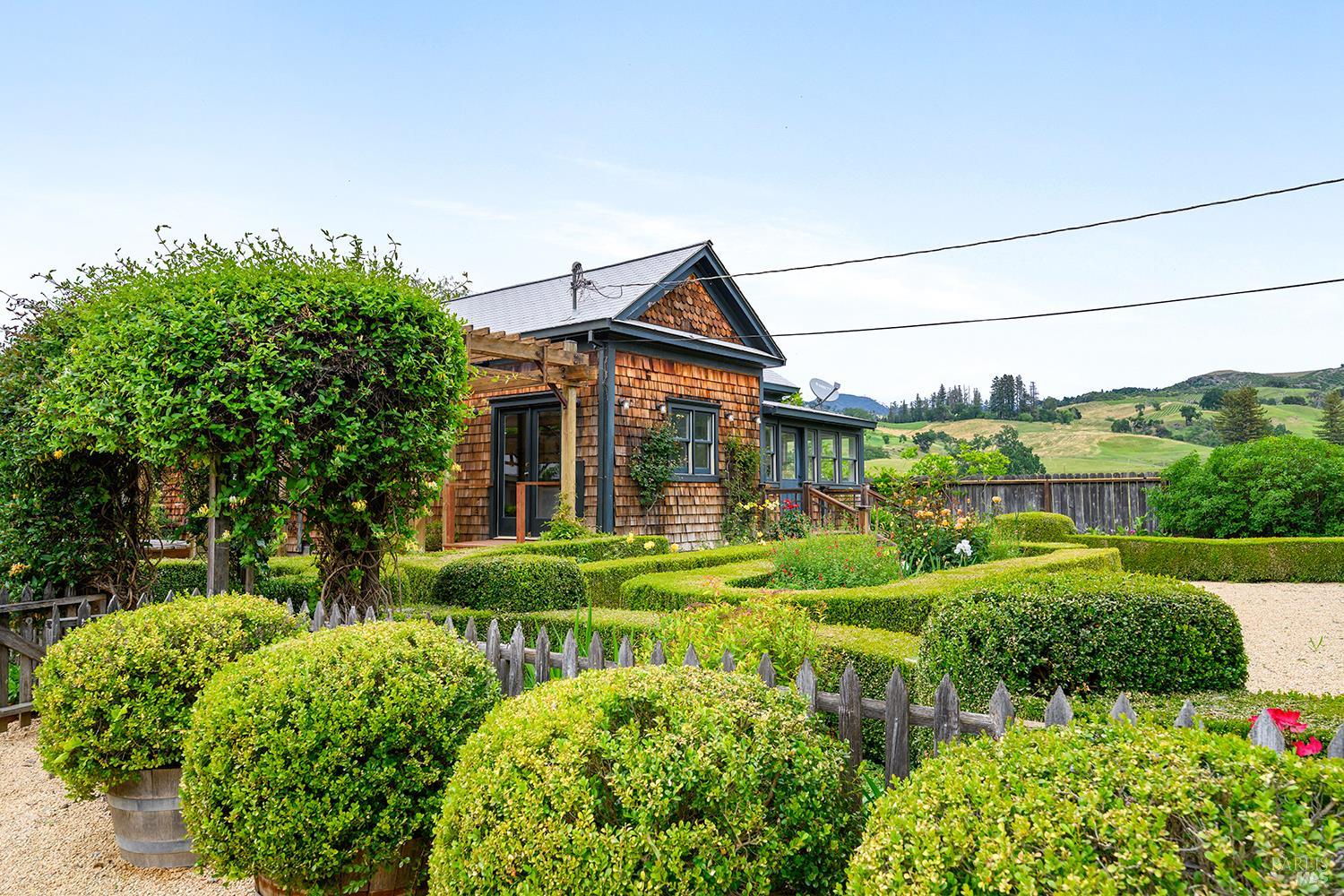6003-6017 Red Winery Road Geyserville, CA 95441 - Photo 53 of 97 a front view of a house with a yard