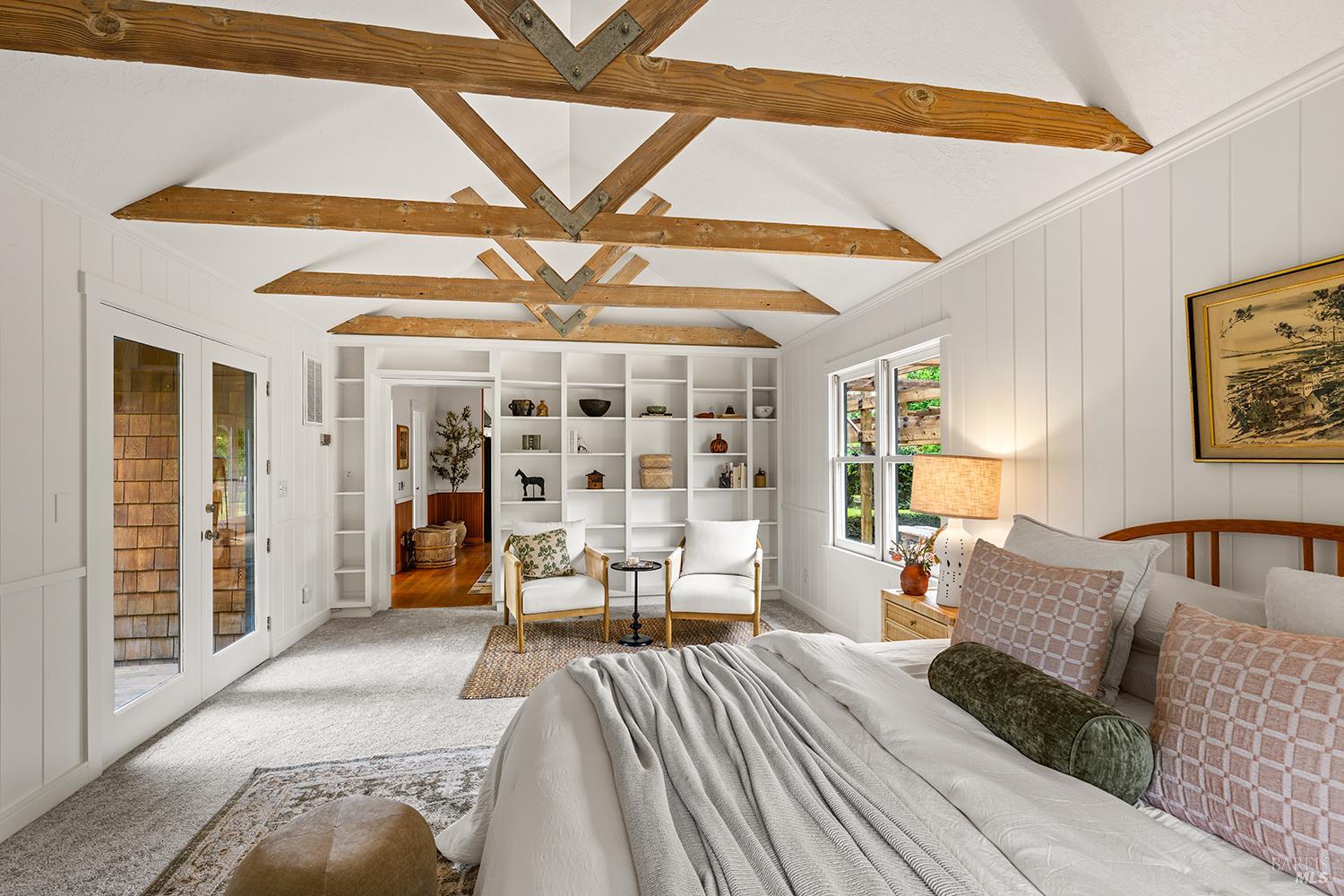 6003-6017 Red Winery Road Geyserville, CA 95441 - Photo 67 of 97 a spacious bedroom with a bed a table and chair