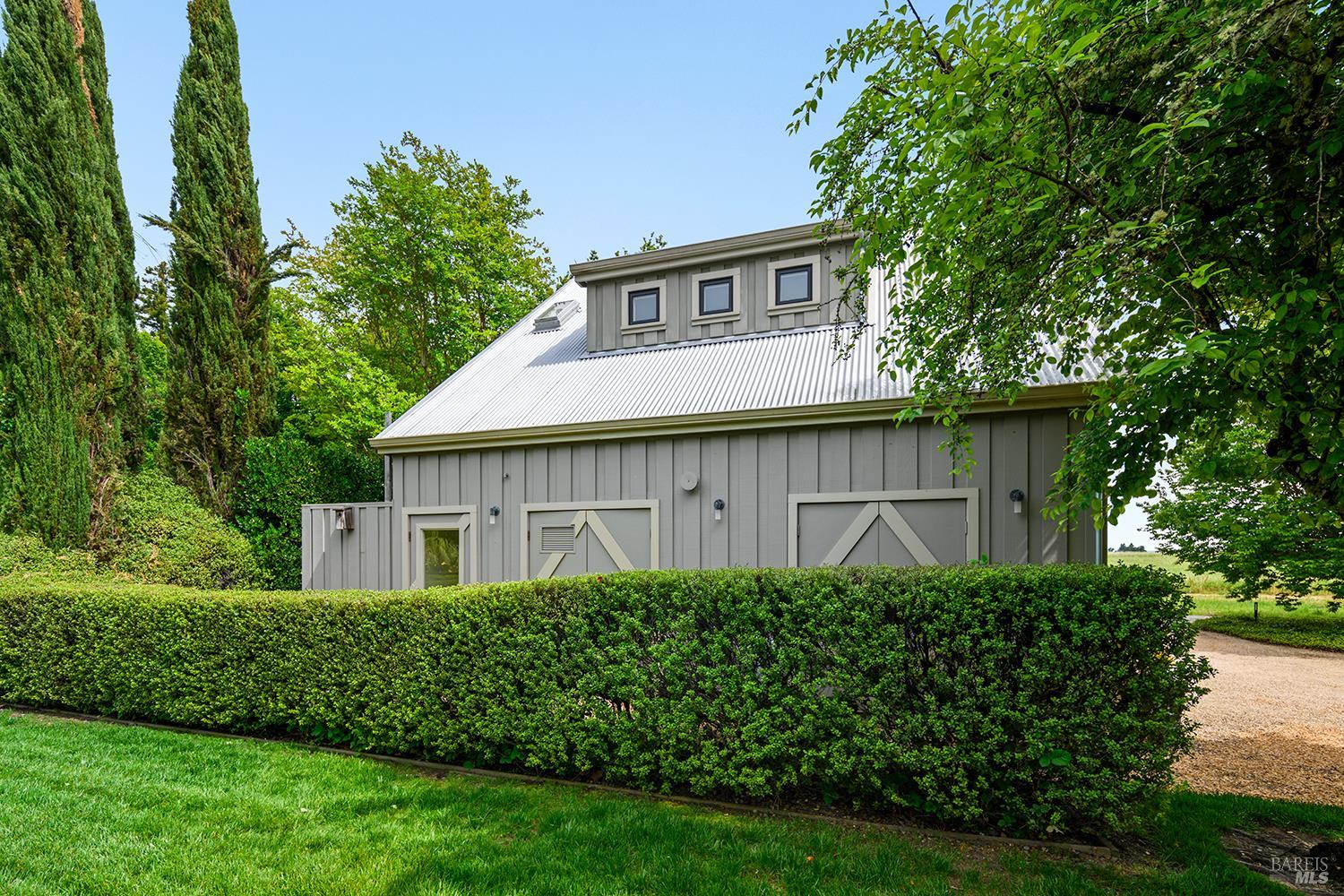 6003-6017 Red Winery Road Geyserville, CA 95441 - Photo 68 of 97 a view of a house with a garden