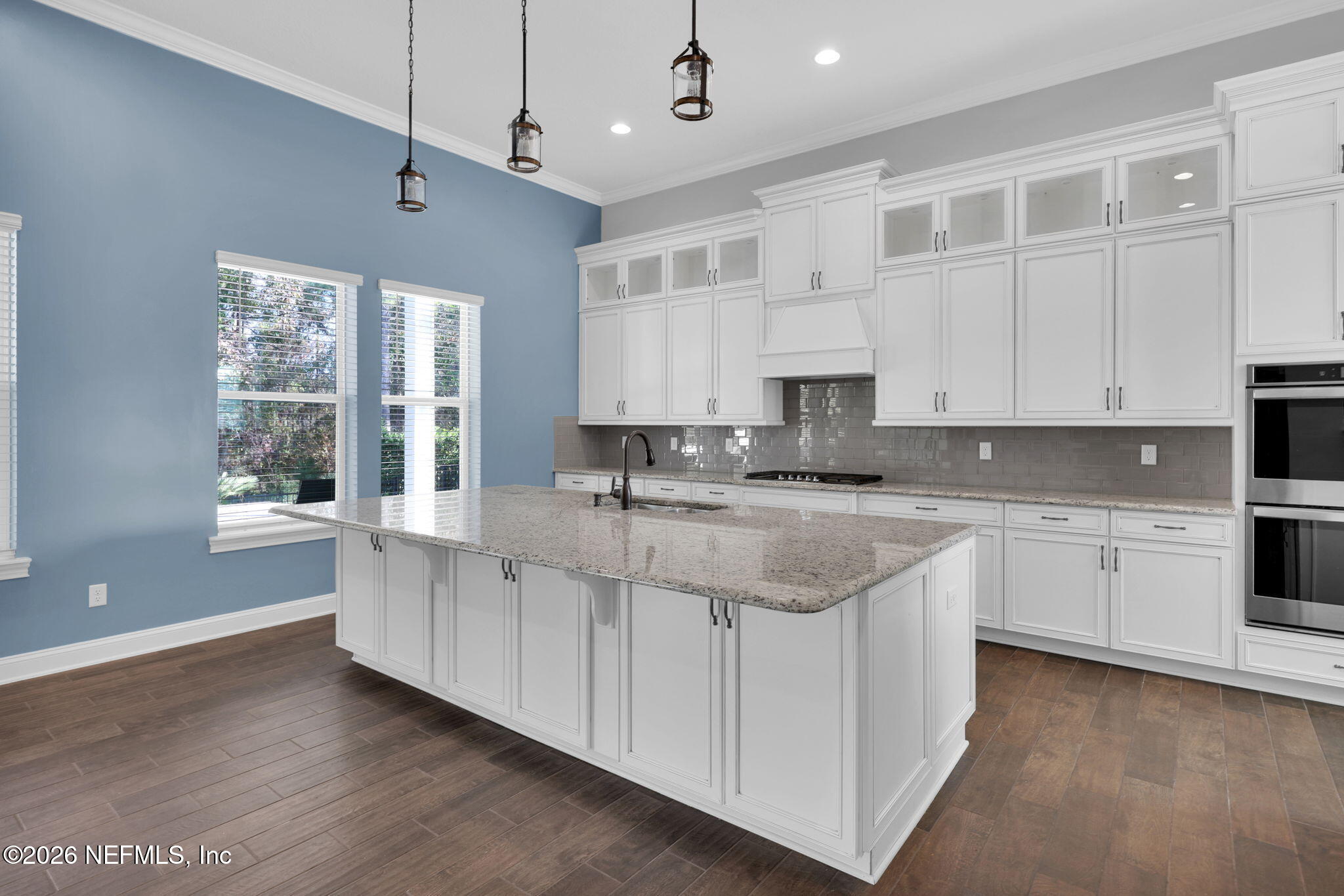 62 Broadleaf Lane St. Johns, FL 32259 - Photo 16 of 62 a large kitchen with granite countertop a sink window and cabinets