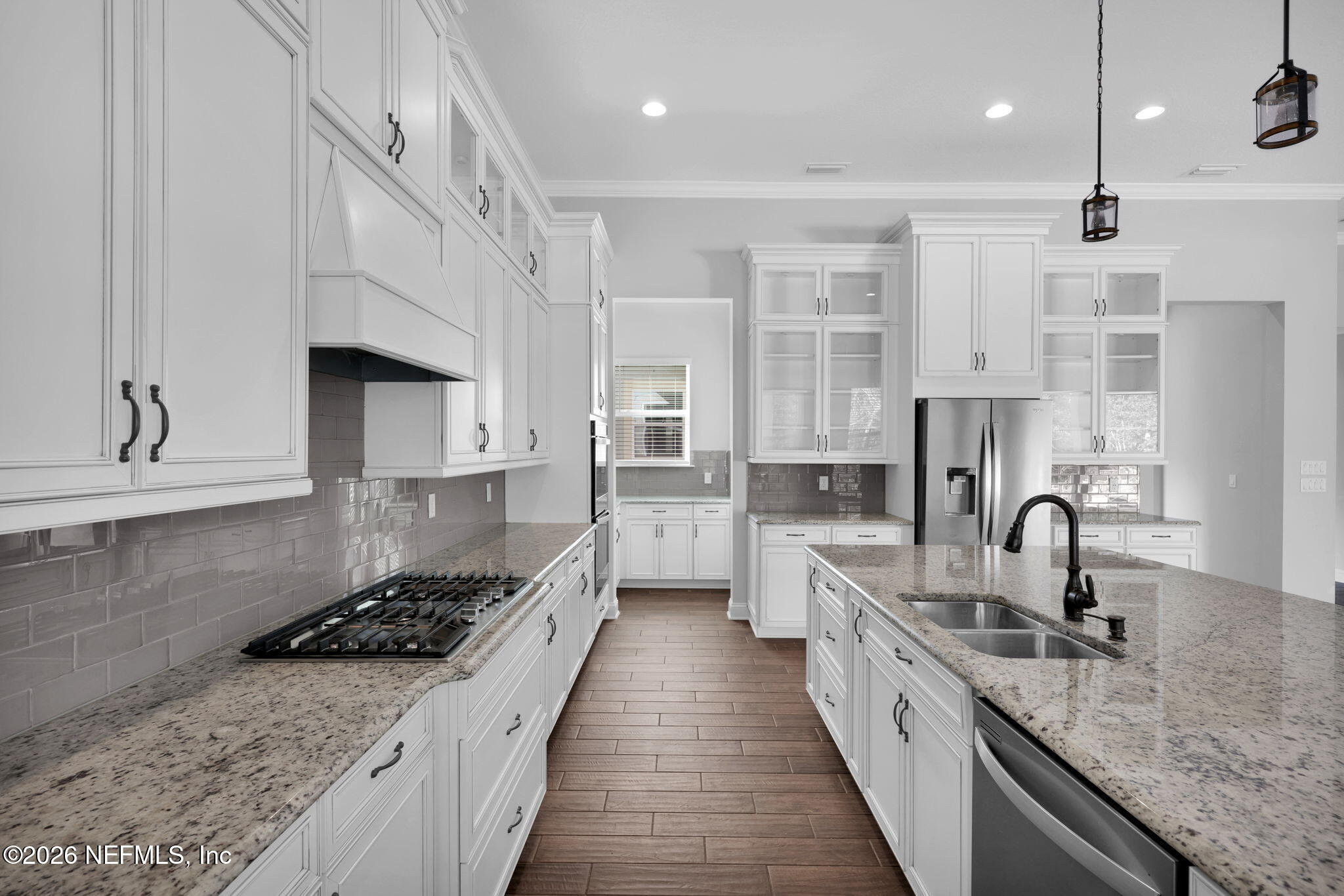 62 Broadleaf Lane St. Johns, FL 32259 - Photo 17 of 62 a large kitchen with stainless steel appliances granite countertop a lot of counter space a sink and cabinets