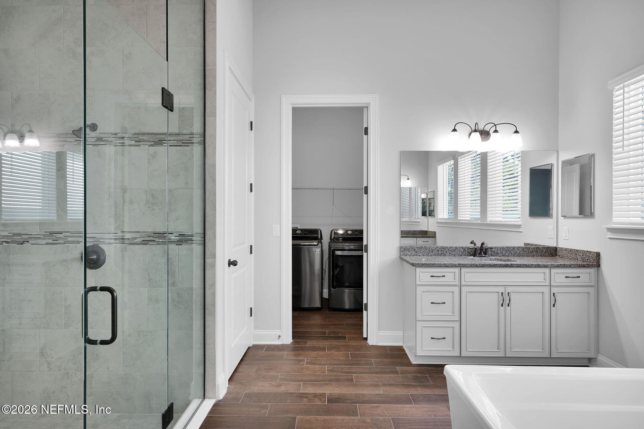 62 Broadleaf Lane St. Johns, FL 32259 - Photo 28 of 62 a spacious bathroom with a granite countertop sink mirror and shower