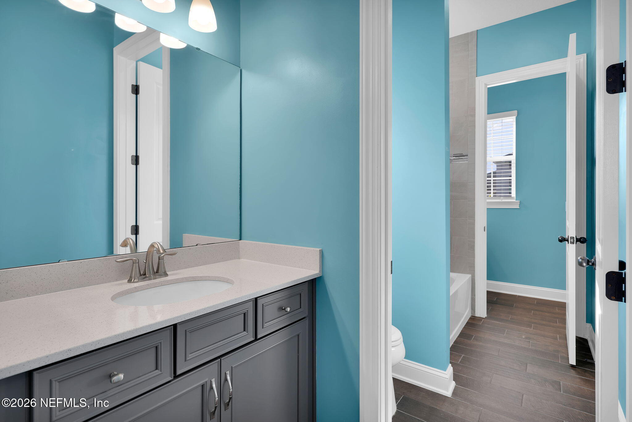 62 Broadleaf Lane St. Johns, FL 32259 - Photo 37 of 62 a bathroom with a sink and a mirror