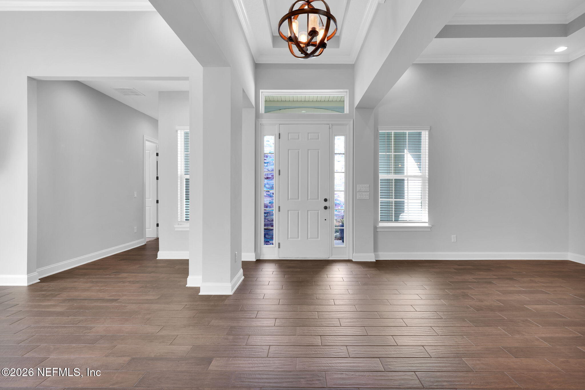 62 Broadleaf Lane St. Johns, FL 32259 - Photo 4 of 62 a view of an empty room with wooden floor and a window