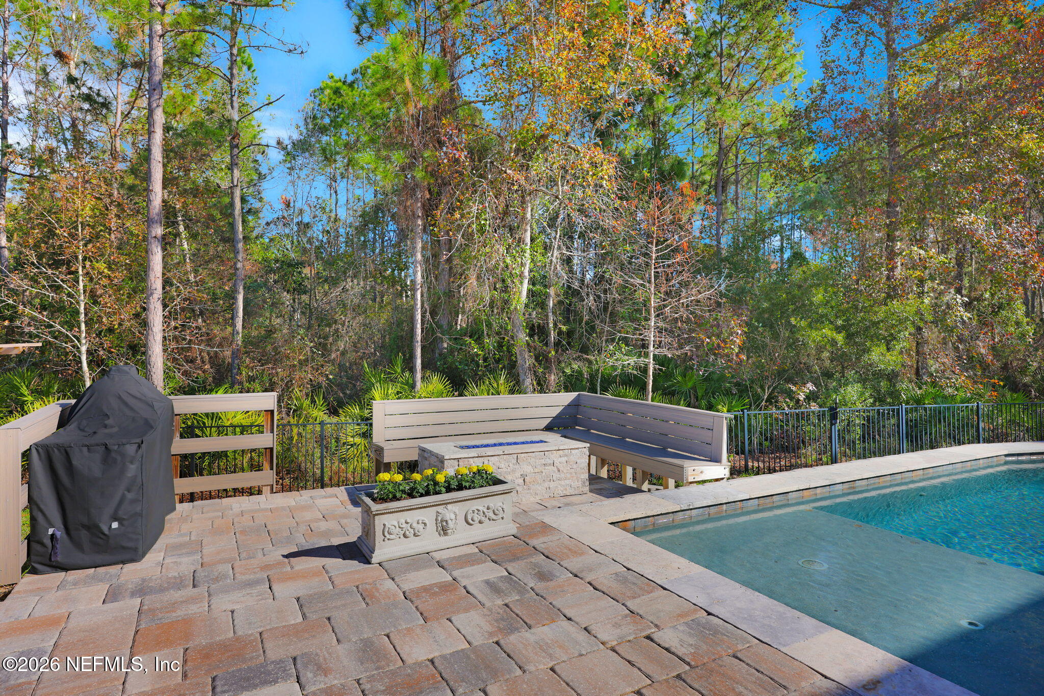62 Broadleaf Lane St. Johns, FL 32259 - Photo 46 of 62 a view of a patio with couches and a table and chairs with wooden fence