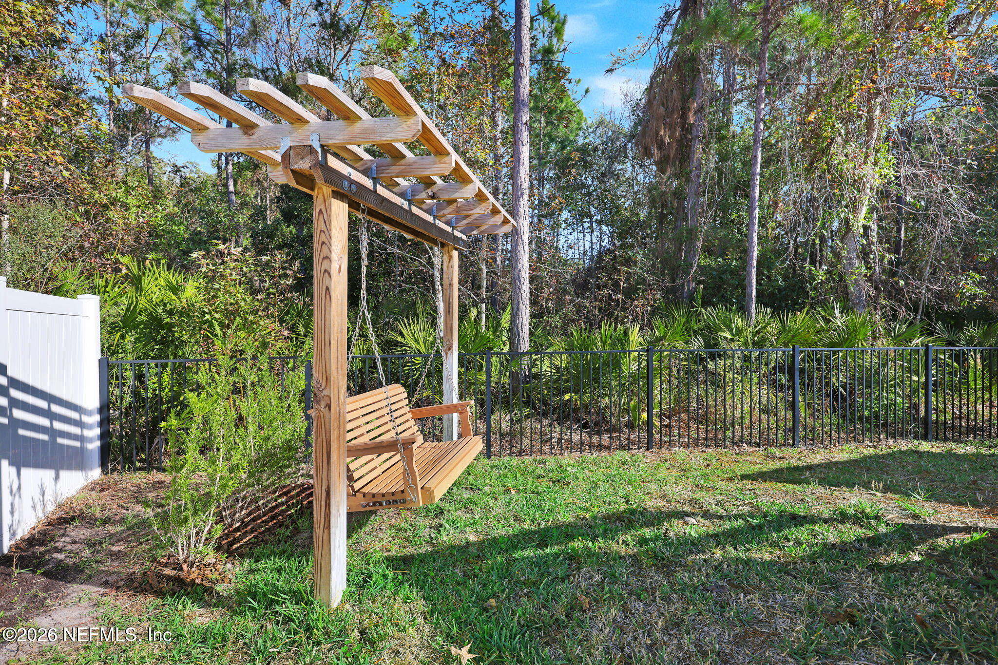 62 Broadleaf Lane St. Johns, FL 32259 - Photo 48 of 62 a view of a chair and table in backyard of the house