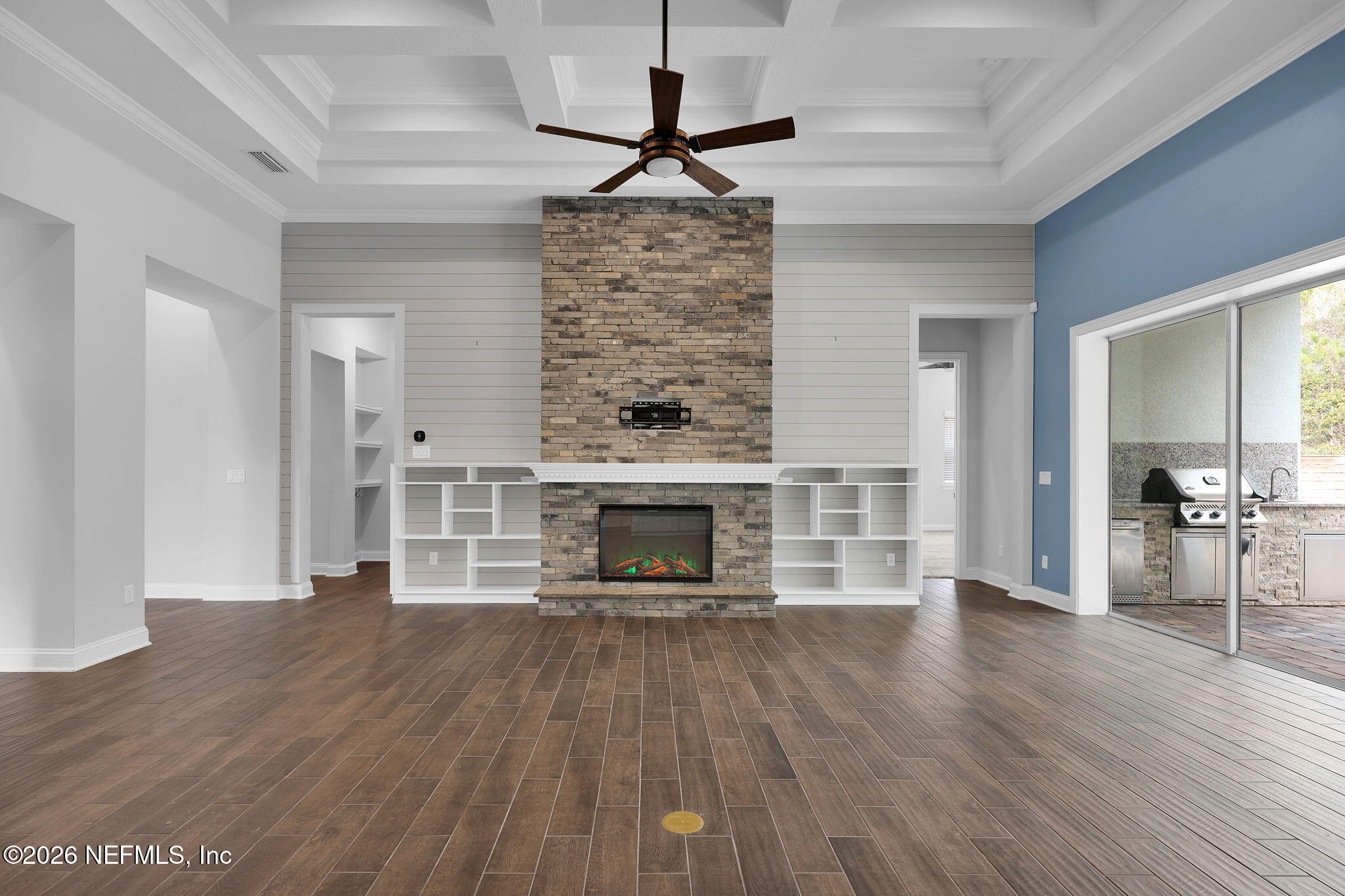 62 Broadleaf Lane St. Johns, FL 32259 - Photo 9 of 62 a living room with a fireplace and wooden floor