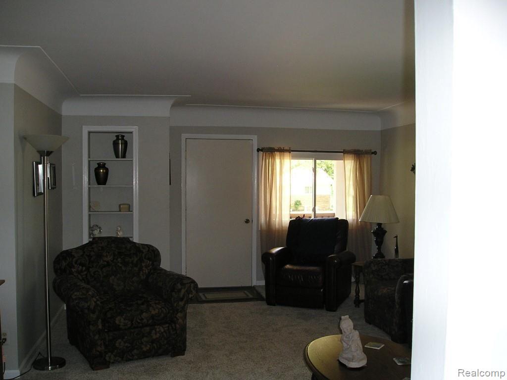 13845 Hough Road Allenton, MI 48002 - Photo 17 of 30 Living room showing doorway to front door and porch