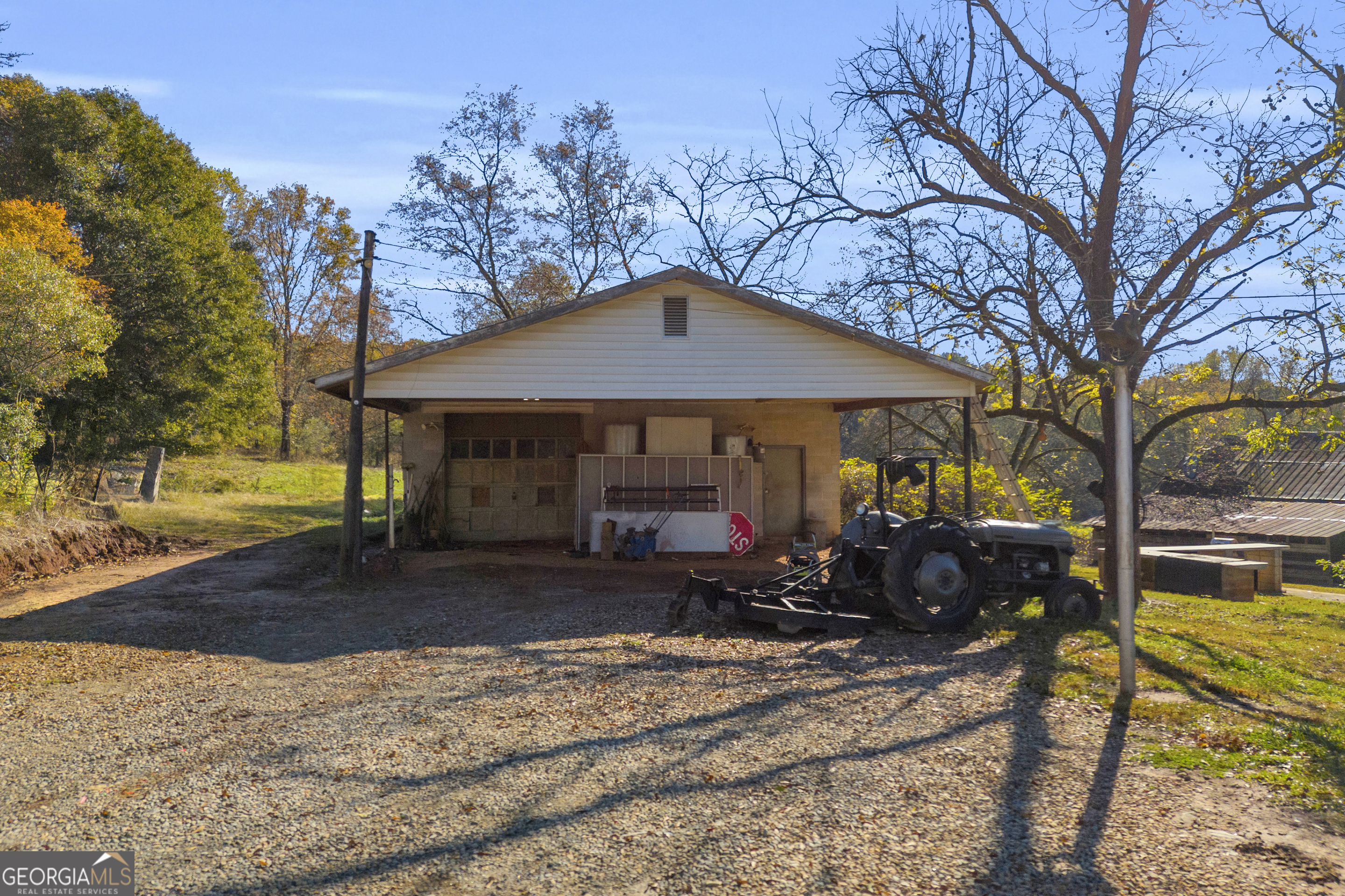 1129 Lord Road Commerce, GA 30530 - Photo 12 of 30 a front view of a house with garden