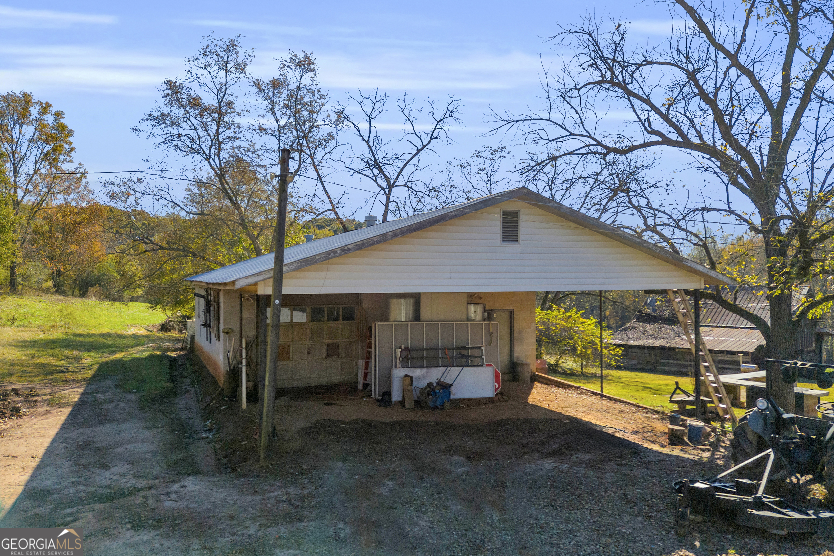 1129 Lord Road Commerce, GA 30530 - Photo 13 of 30 a view of a house with backyard and sitting area