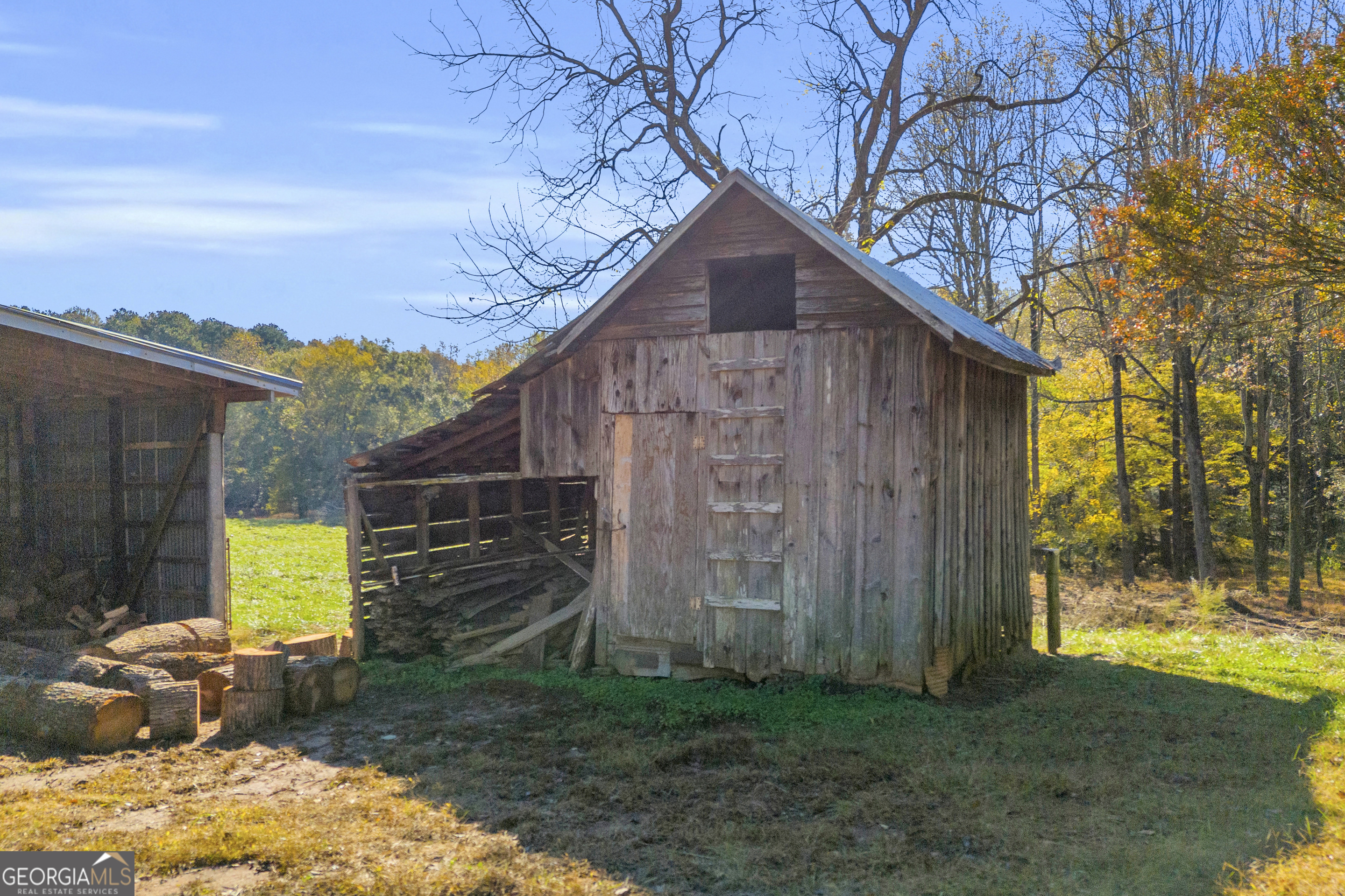 1129 Lord Road Commerce, GA 30530 - Photo 18 of 30 a brick house with a large tree in front of it