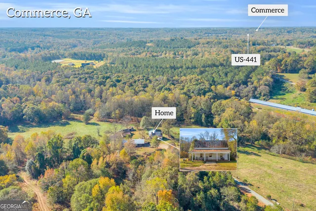 a view of a house with swimming pool and sitting area