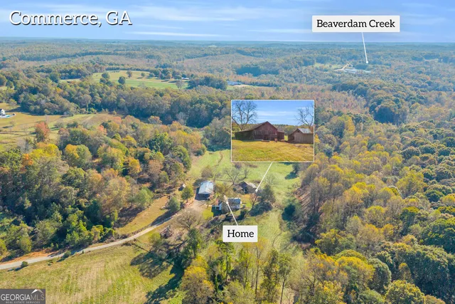 a front view of a house with a yard table and chairs